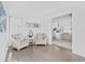 Bright living room features modern decor, natural light, and an open floor plan that flows into the kitchen and the seating area at 2050 Nigels Dr, Dunedin, FL 34698