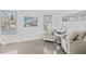 Cozy sitting area with comfortable armchairs, bright decor and lots of natural light at 2050 Nigels Dr, Dunedin, FL 34698