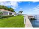 Waterfront home features lush landscaping, private dock, and beautiful views of the bay at 2090 Iowa Ne Ave, St Petersburg, FL 33703