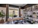 Stylish home office with modern desk, shelving, and natural light at 29912 Rusco Ct, Wesley Chapel, FL 33545