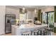 Spacious kitchen with stainless steel appliances, a large island, and stylish pendant lighting at 29912 Rusco Ct, Wesley Chapel, FL 33545