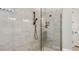 Modern bathroom shower with glass enclosure and tiled walls at 29912 Rusco Ct, Wesley Chapel, FL 33545