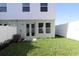 Fenced backyard with lush green lawn and patio at 3021 W Ballast Pt # 2, Tampa, FL 33611