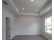 Spacious bedroom with trey ceiling and natural light at 3021 W Ballast Pt # 2, Tampa, FL 33611