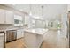 Bright kitchen with stainless steel appliances and an island at 3021 W Ballast Pt # 2, Tampa, FL 33611
