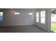 Bright living room with large windows and hardwood floors at 3021 W Ballast Pt # 2, Tampa, FL 33611