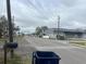 Street view of a vacant lot with commercial buildings nearby at 4104 W Osborne Ave, Tampa, FL 33614