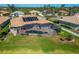 This house features an amazing screened-in pool with solar panels to keep the water warm at 412 Arborview Ln, Venice, FL 34292