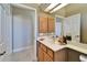 Bathroom featuring a vanity with cabinets, a sink, and a large mirror at 412 Arborview Ln, Venice, FL 34292