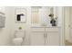 Bright bathroom with white cabinets, framed art, and neutral decor at 4510 S Manhattan Ave # 6, Tampa, FL 33611