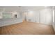 Bright living room featuring wood-look tile floors, fresh white walls, and lots of natural light at 4511 S Manhattan Ave # 28, Tampa, FL 33611