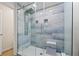 Modern bathroom shower with tiled walls, rainfall shower head, and glass enclosure at 5001 Shetland Ave, Tampa, FL 33615