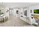 Bright and spacious living area with open floor plan, modern furnishings, and a stylish dining space at 5024 124Th E Ave, Parrish, FL 34219