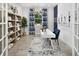 Home office featuring a modern desk, shelving, decorative accents, and natural lighting at 5024 124Th E Ave, Parrish, FL 34219