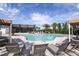 Beautiful community pool area with lounge chairs, clubhouse, and lush landscaping at 5024 124Th E Ave, Parrish, FL 34219