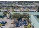 Bird's eye view of condominium community lined with palm trees in a quiet neighborhood at 6033 113Th St # 213, Seminole, FL 33772