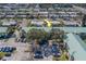 Bird's eye view of condominium community lined with palm trees in a quiet neighborhood at 6033 113Th St # 213, Seminole, FL 33772