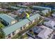 Overhead view of condominium community featuring a swimming pool, parking, and lush landscaping at 6033 113Th St # 213, Seminole, FL 33772