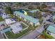 Aerial view of a condo community featuring verdant surroundings, convenient parking, and nearby pond at 6033 113Th St # 213, Seminole, FL 33772