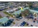 An aerial shot of a condo building with a well-maintained parking lot and landscaped grounds at 6033 113Th St # 213, Seminole, FL 33772