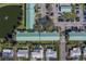 Aerial view of the community, featuring a pond, parking, and residential buildings at 6033 113Th St # 213, Seminole, FL 33772