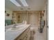 Bright bathroom featuring a large mirror, granite countertop, and shower-tub combination at 6033 113Th St # 213, Seminole, FL 33772