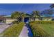 Well-maintained exterior featuring a manicured yard and vibrant landscaping at 6033 113Th St # 213, Seminole, FL 33772
