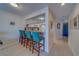 Open kitchen with a breakfast bar and seating, offering a view into other living spaces at 6033 113Th St # 213, Seminole, FL 33772