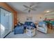Well-lit living room featuring comfy seating, and access to an outdoor lanai at 6033 113Th St # 213, Seminole, FL 33772