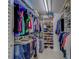 Spacious walk-in closet with ample storage, shelving, and organized hanging space at 6033 113Th St # 213, Seminole, FL 33772