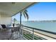 Balcony with outdoor seating, palm trees and panoramic views of the water at 6083 Bahia Del Mar Cir # 359, St Petersburg, FL 33715
