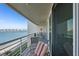 Balcony featuring beach view and outdoor seating with view of a bridge in the distance at 6083 Bahia Del Mar Cir # 359, St Petersburg, FL 33715