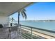 Balcony with outdoor seating, palm trees and panoramic views of the water at 6083 Bahia Del Mar Cir # 359, St Petersburg, FL 33715