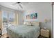 Cozy bedroom features natural light, neutral walls and coastal-themed decorations at 6083 Bahia Del Mar Cir # 359, St Petersburg, FL 33715