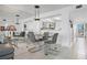 Sunlit dining room area with modern chairs and a glass top table at 6083 Bahia Del Mar Cir # 359, St Petersburg, FL 33715