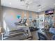 Well-equipped gym featuring treadmills, weights, and a flat-screen TV for convenient workouts at 6083 Bahia Del Mar Cir # 359, St Petersburg, FL 33715