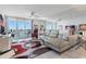 Bright and airy living room with large windows and a comfortable seating area at 6083 Bahia Del Mar Cir # 359, St Petersburg, FL 33715