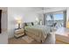 Serene bedroom with balcony, views of the water, and comfortable furnishings at 6083 Bahia Del Mar Cir # 359, St Petersburg, FL 33715