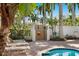 Outdoor shower by the pool for rinsing off after a swim with lounge chairs at 6083 Bahia Del Mar Cir # 359, St Petersburg, FL 33715