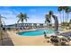 Inviting pool area featuring comfortable seating, scenic views of the bridge, and mature palm trees at 6083 Bahia Del Mar Cir # 359, St Petersburg, FL 33715