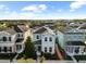 Aerial shot shows a well-maintained neighborhood with a clear view of the light blue home at 6157 Castleton Hollow Rd, Riverview, FL 33578