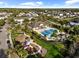 Aerial view features community pool, playground, and gathering area surrounded by mature trees in a beautiful neighborhood at 6157 Castleton Hollow Rd, Riverview, FL 33578