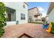 Spacious brick-paved backyard, perfect for outdoor entertaining and play at 6157 Castleton Hollow Rd, Riverview, FL 33578