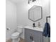 Stylish half-bathroom featuring modern fixtures and a sleek gray vanity at 6157 Castleton Hollow Rd, Riverview, FL 33578