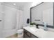 Well lit bathroom with a shower tub combination, modern vanity and neutral color palette at 6157 Castleton Hollow Rd, Riverview, FL 33578