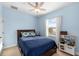 bedroom painted light blue with light colored carpets and a large double bed at 6157 Castleton Hollow Rd, Riverview, FL 33578
