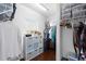 Organized walk-in closet with built-in shelving and hanging racks providing ample storage at 6157 Castleton Hollow Rd, Riverview, FL 33578