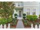 Inviting front porch with decorative wreath and manicured shrubs welcomes you to this lovely home at 6157 Castleton Hollow Rd, Riverview, FL 33578