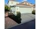Detached garage with a paved driveway and manicured landscaping at 6157 Castleton Hollow Rd, Riverview, FL 33578