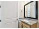 Bathroom vanity with granite countertop, modern fixtures, and framed mirror offering a clean design at 7266 Kodiak Ln, Sarasota, FL 34240